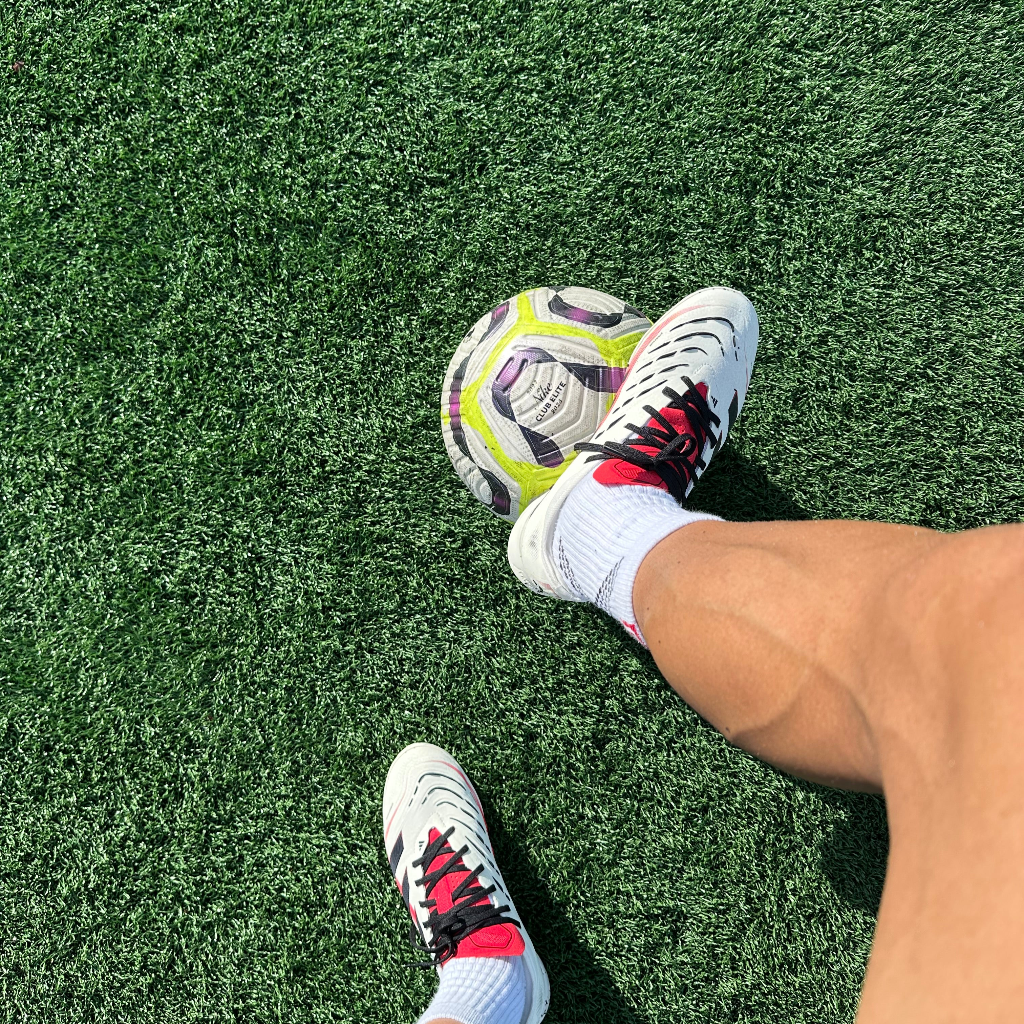 Whispers of victory in each kick, the field calls to the heart of every player.